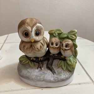 Vintage porcelain owl family on branch